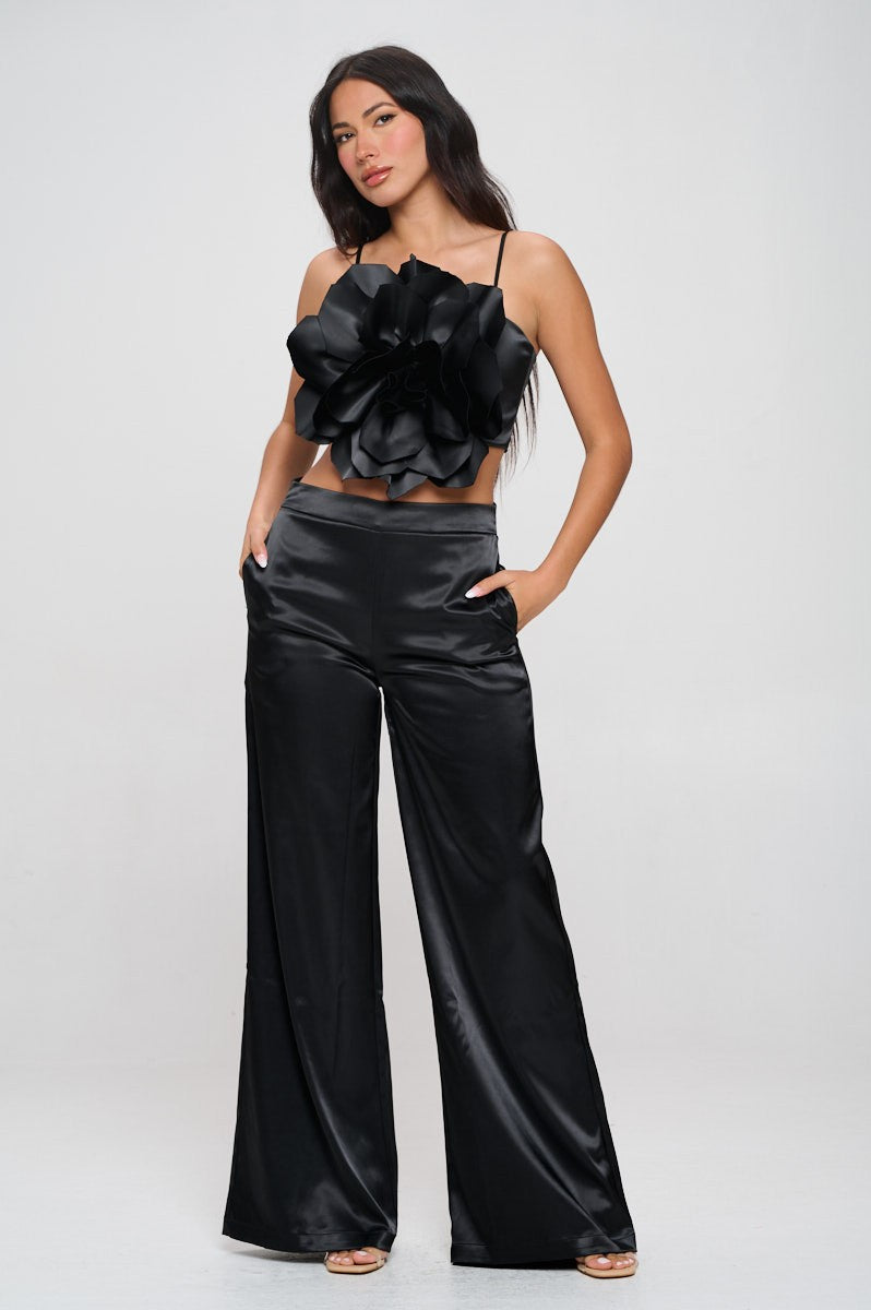 Blooming Bombshell two-piece set featuring oversized floral crop top and high-rise satin pants in black