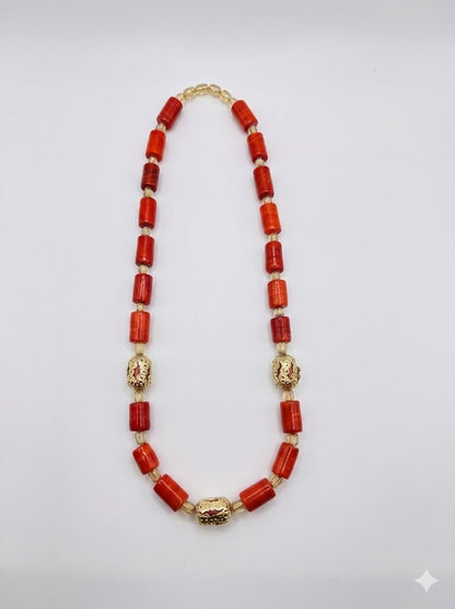 Close‑up of African Ancestral Elegance coral bead necklace with heritage‑inspired design